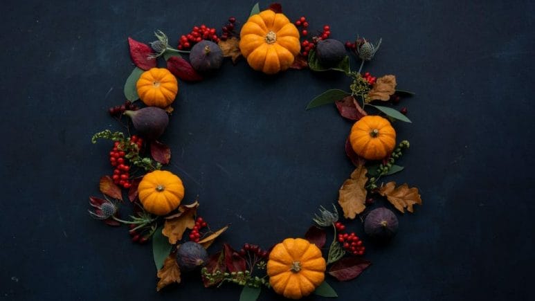 thanksgiving themed wreath with pumpkins and leaves