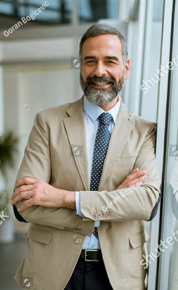 stock-photo-portrait-of-handsome-senior-businessman-in-the-office-1345063331